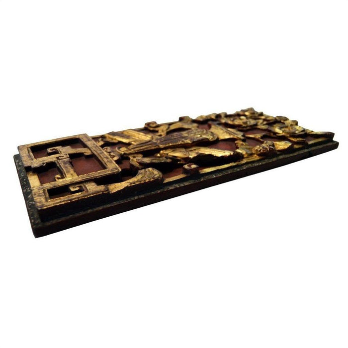Gold gilded wood Chinese temple ornament, hand carved, ornate design, close-up, low angle on white background.