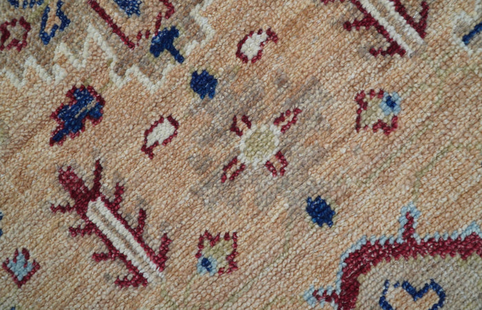 Astra Turkish hand-knotted wool rug, peach field with blue and red geometric motifs