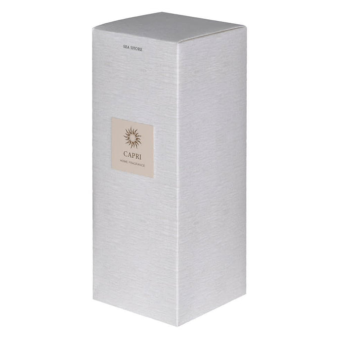 A tall, rectangular silver-gray home fragrance box with a textured finish, featuring a beige square label on the front that reads 'CAPRI HOME FRAGRANCE' with a sunburst logo. The top of the box has 'SEA SPICE' printed in small text.
