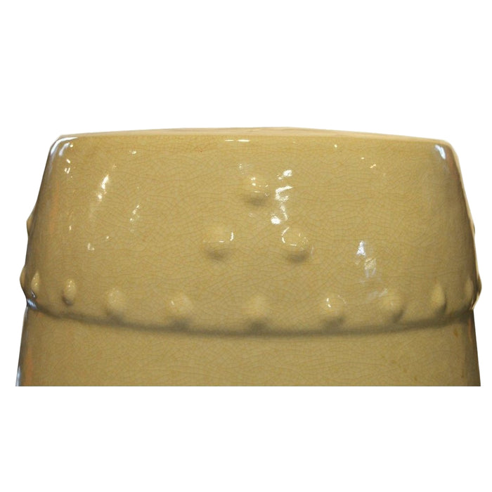 Celadon porcelain garden seat with beaded raised dots and textured rim on a white background.