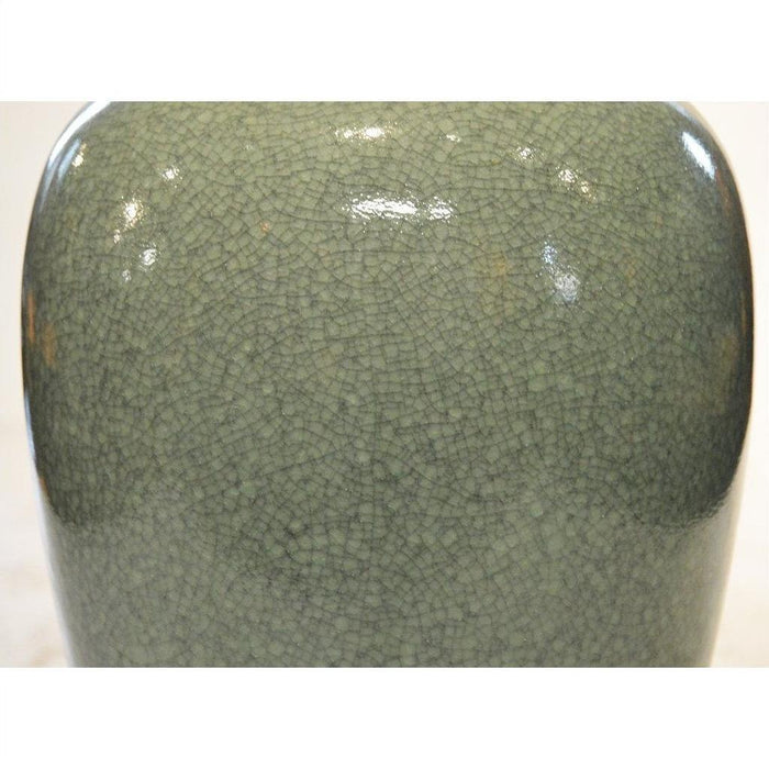 Close-up of green crackle-glaze celadon porcelain altar vase, smooth and glossy finish.