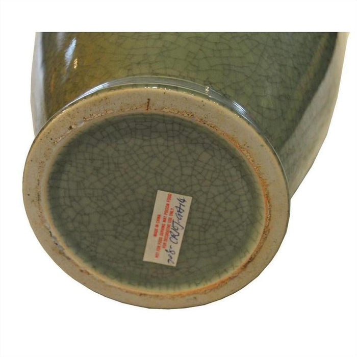 Close-up of bottom of green celadon crackle glaze porcelain altar vase with small label featuring red and blue text.