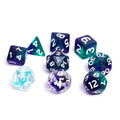 Daggerheart duality dice set by Sirius Dice featuring blue and green translucent polyhedral dice with white numbers