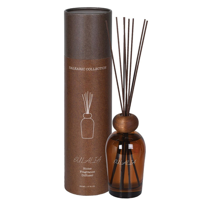Brown diffuser bottle with wooden cap and packaging on a white background