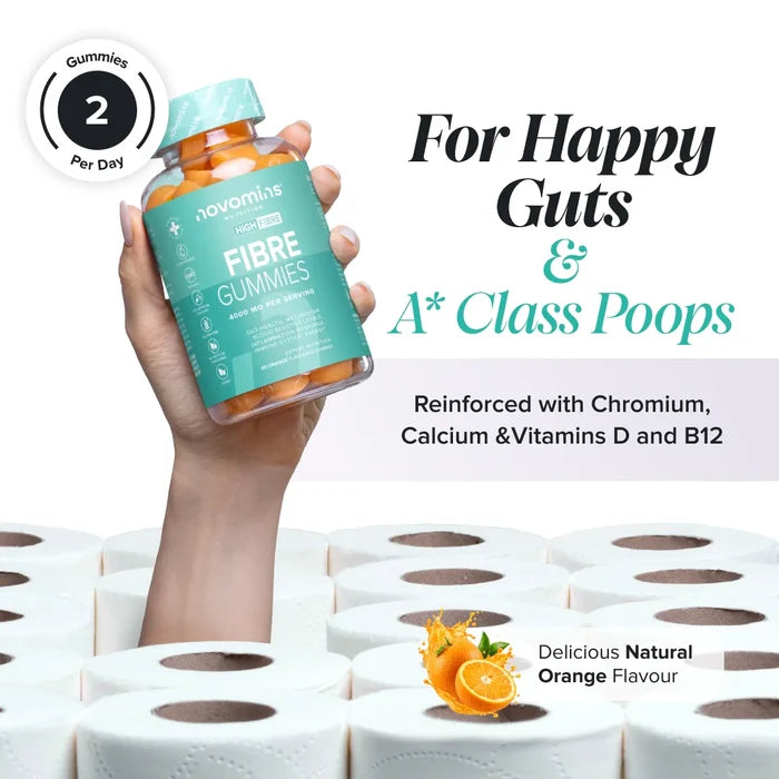 A hand holds a bottle of Novomins Fibre Gummies above a stack of toilet rolls, headed 'For Happy Guts & A* Class Poops' and reinforced with chromium, calcium and vitamins D and B12, in a natural orange flavour with two gummies per day.