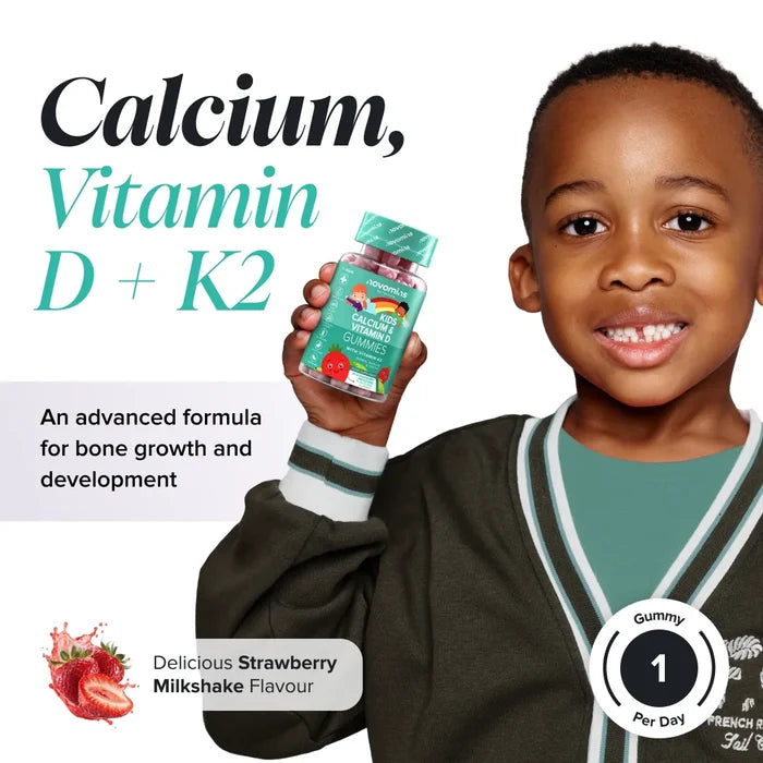 A smiling boy in a dark green cardigan holds a bottle of Novomins Kids Calcium & Vitamin D Gummies, headed 'Calcium, Vitamin D + K2, an advanced formula for bone growth and development', in a strawberry milkshake flavour with one gummy per day.
