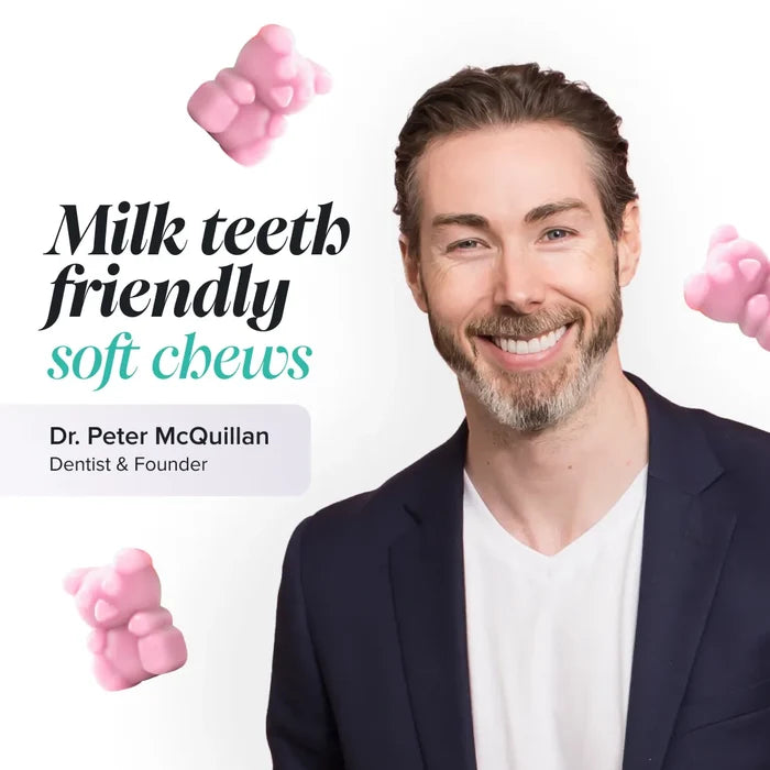 Dr Peter McQuillan, dentist and founder, smiling in a navy blazer on a white background with floating pale pink gummy bears, beside the text 'Milk teeth friendly soft chews'.