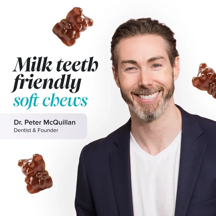 Dr Peter McQuillan, dentist and founder, smiling in a navy blazer on a white background with floating brown gummy bears, beside the text 'Milk teeth friendly soft chews'.