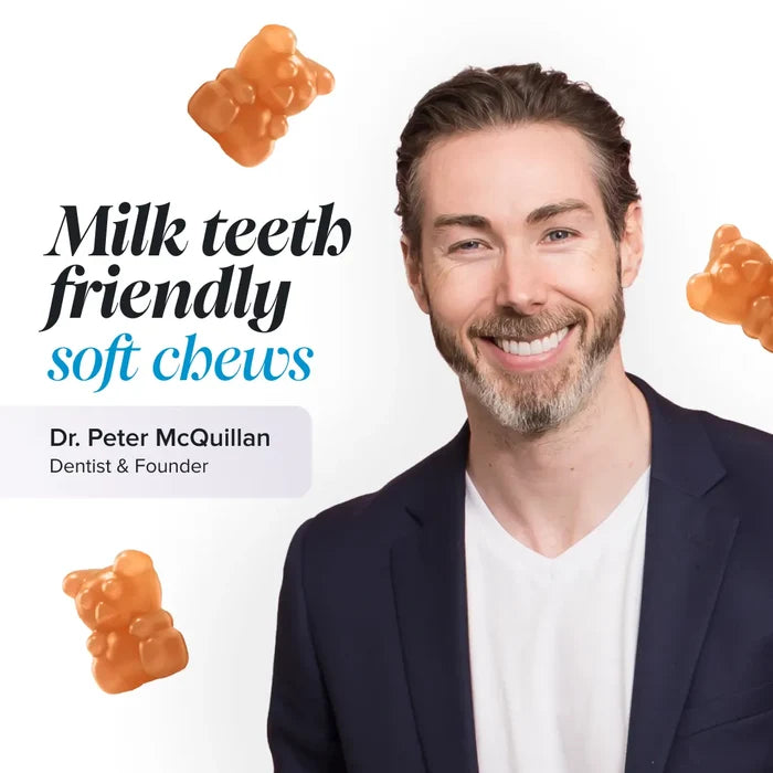Dr Peter McQuillan, dentist and founder, smiling in a navy blazer among floating orange gummy bears, beside the text 'Milk teeth friendly soft chews'.