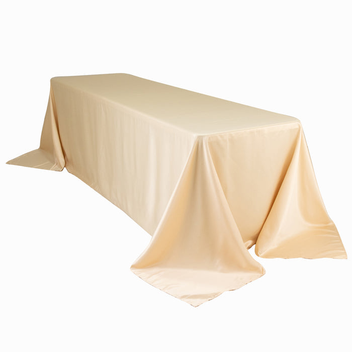 Beige tablecloth draped over a rectangular table