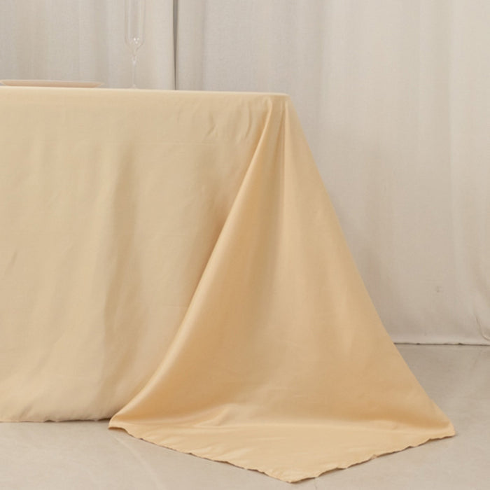 Beige tablecloth draped elegantly over a table.