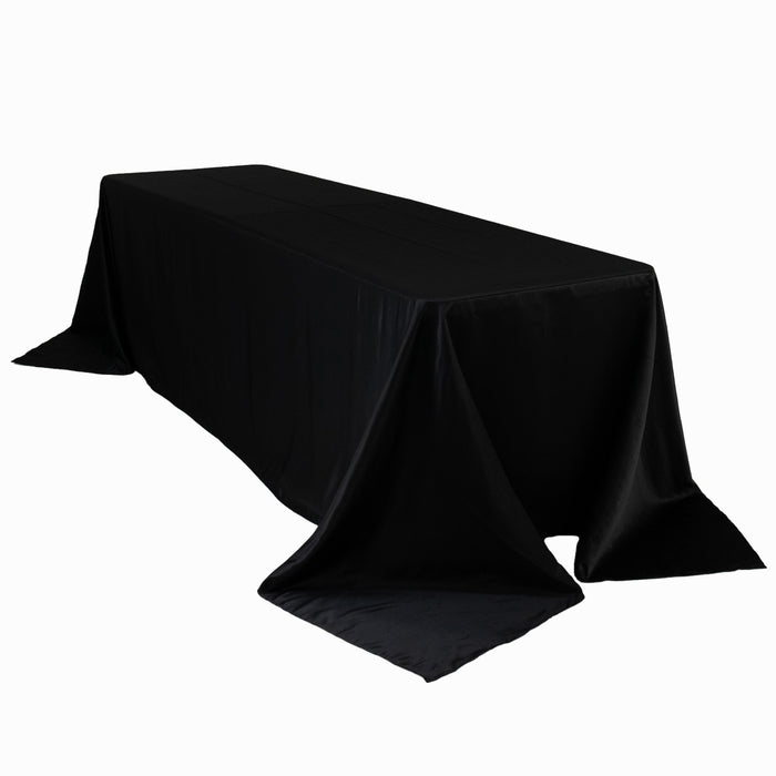 Black tablecloth draped elegantly over a long table