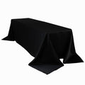 Black tablecloth draped elegantly over a long table