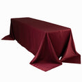 Burgundy tablecloth draping over a rectangular table