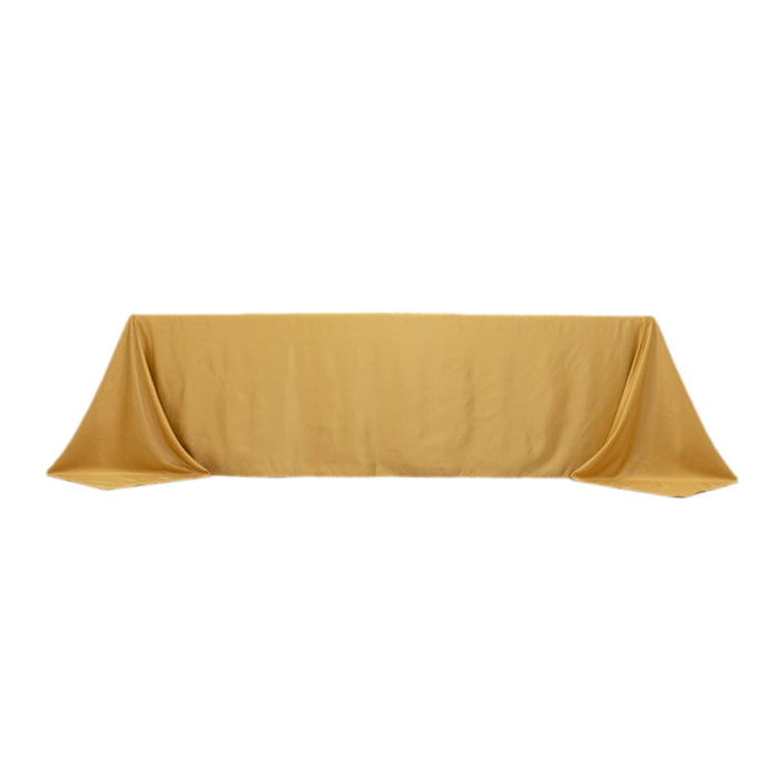 Gold tablecloth draped elegantly on a surface