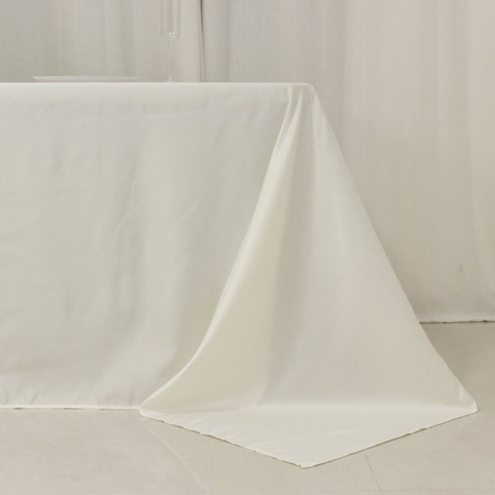 Elegant white tablecloth draping over a table corner for a refined dining setting.