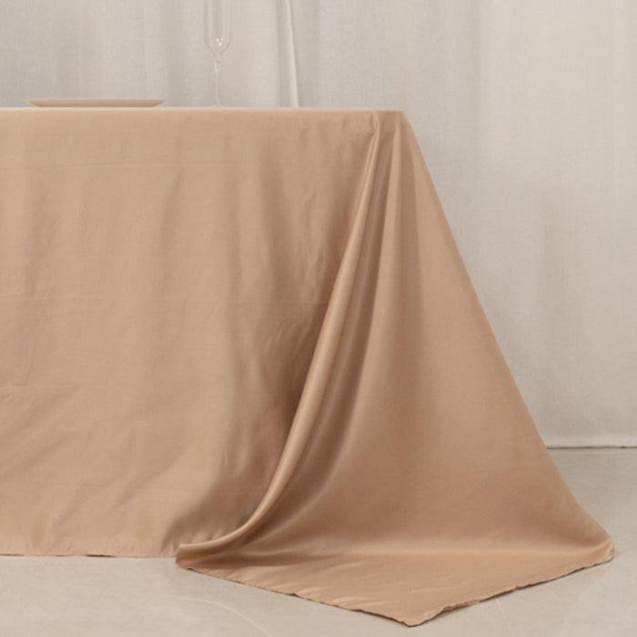 Beige tablecloth draped elegantly over a table.