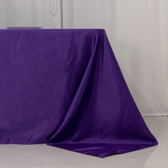 Purple tablecloth draped elegantly over a table.