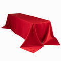 Red tablecloth draped elegantly over a rectangular table