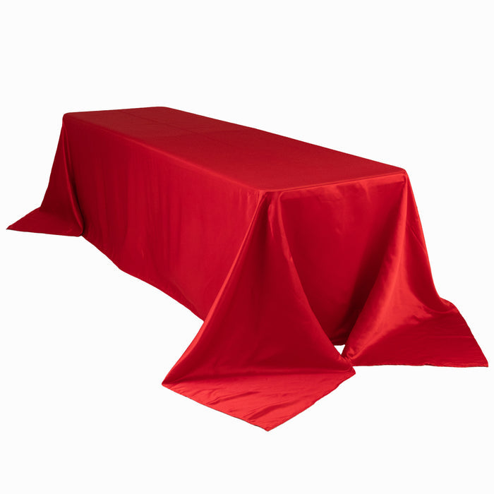 Red tablecloth draped elegantly over a rectangular table