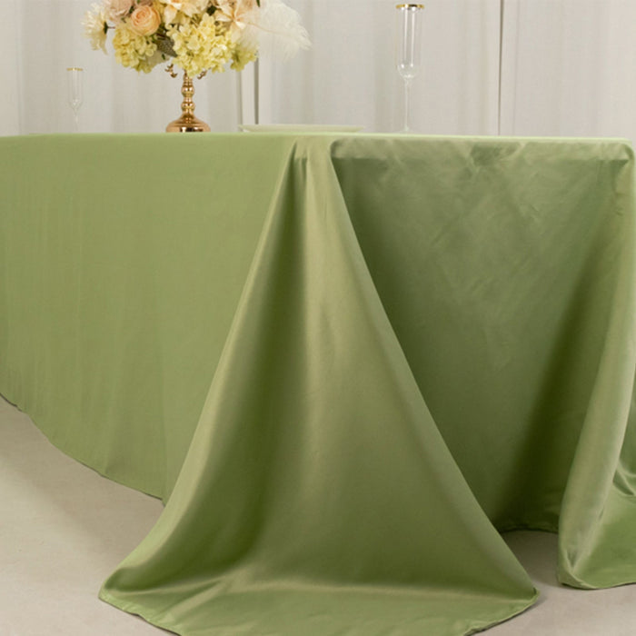 Green tablecloth draped elegantly over a table for events or décor.