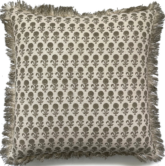 A square throw pillow with a beige and brown block-printed floral pattern and fringed edges, shown against a plain white background.