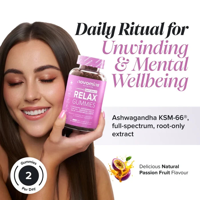 A smiling woman with long brown hair holds a bottle of Novomins Relax Gummies to her cheek, headed 'Daily Ritual for Unwinding & Mental Wellbeing' with ashwagandha KSM-66 full-spectrum root-only extract, in a natural passion fruit flavour with two gummies per day.