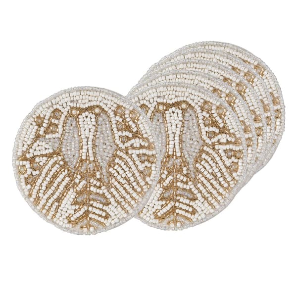 Two round beaded placemats with a detailed fish pattern, made from white and gold beads, shown on a plain white background.