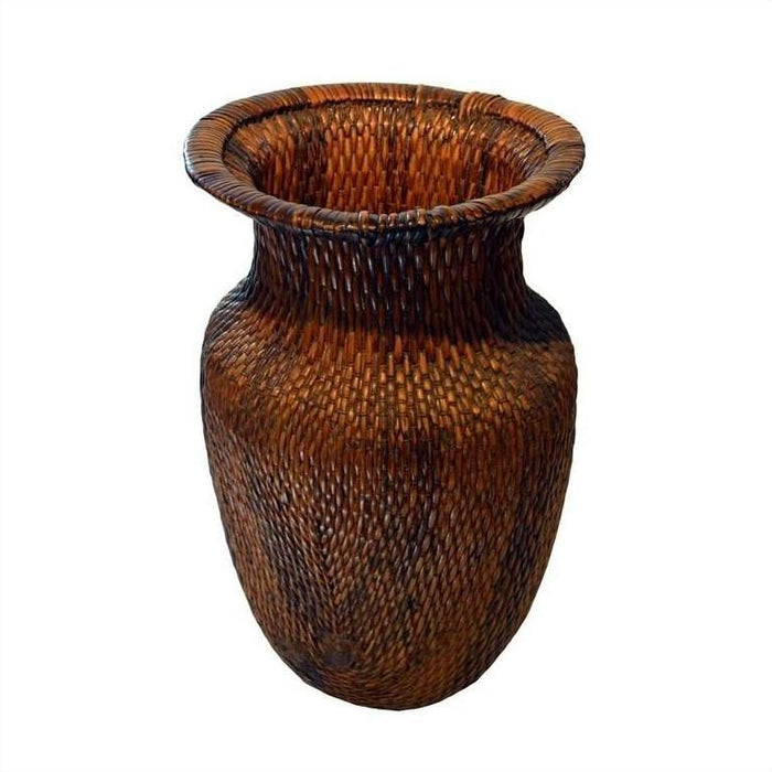 Tall brown wicker Thai grain basket with flared rim, close-up against a plain background.