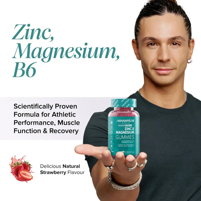 A smiling man with tied-back hair holds out a bottle of Novomins Zinc & Magnesium Gummies, headed 'Zinc, Magnesium, B6 - scientifically proven formula for athletic performance, muscle function and recovery', in a natural strawberry flavour.